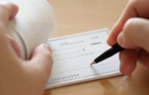 person signing check